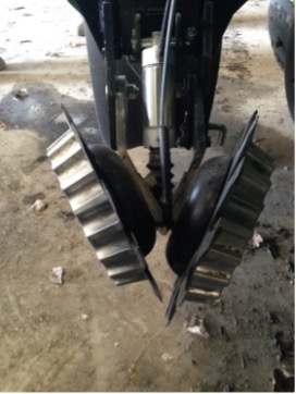 Residue manager mounted in front of planter